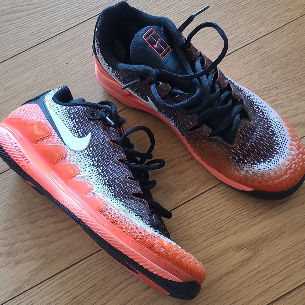 Nike Orange and Black Sneakers with Modern Cushioning